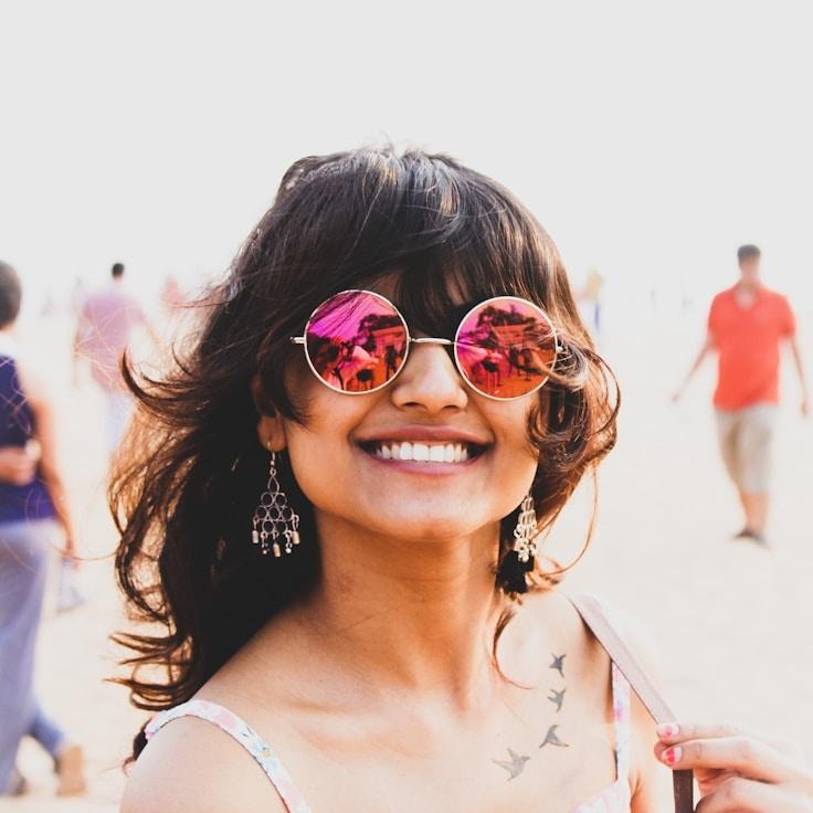 Kaveri Mehta, Lead Design Curator at ShoreFieldForge, reviewing corporate floral arrangements